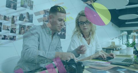 Coworkers Discussing Photographs with Digital Infographics Overlay