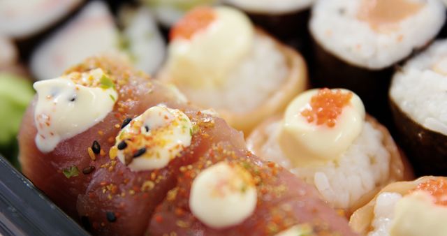 Close-up of a variety of sushi pieces, showcasing the intricate details and garnishes. Sushi is a traditional Japanese dish that has gained worldwide popularity for its flavors and artistic presentation.