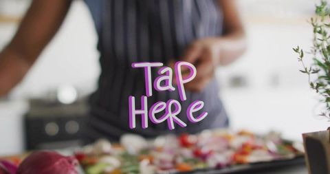 Home cook preparing colorful roasted vegetables with playful purple tap here overlay