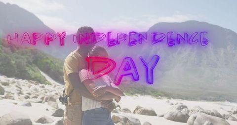 African American Couple Embracing with Independence Day Text