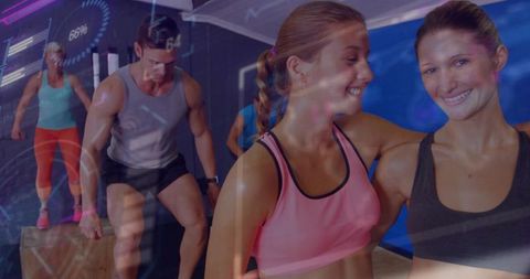 Smiling fit women posing in neon fitness studio wearing sports bras with hud overlays