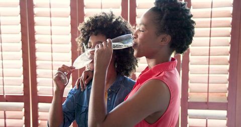 Two African American Women Enjoying Champagne Together