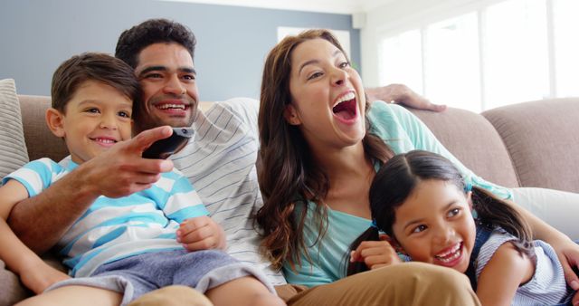 Happy Family Watching TV at Home - Download Free Stock Images Pikwizard.com