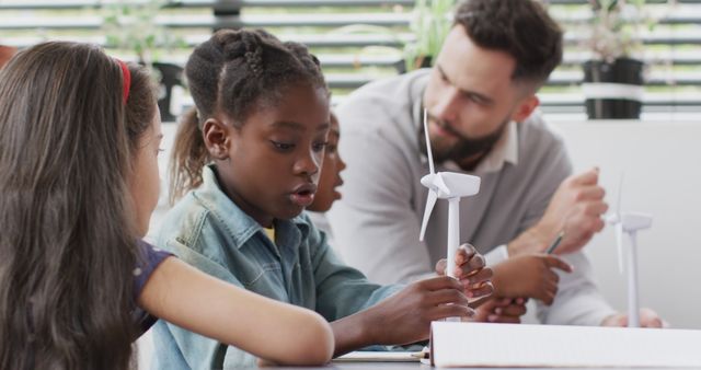 Teacher Engaging with Diverse Children in Renewable Energy Science Activity - Download Free Stock Images Pikwizard.com