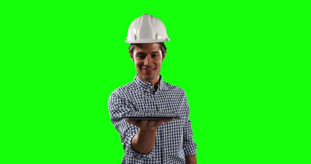 Male Engineer Holding Tablet Against Green Screen Background - Download Free Stock Images Pikwizard.com