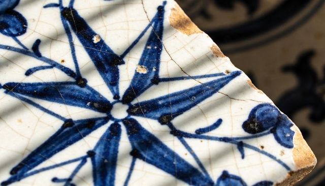 Handpainted cobalt blue ceramic shard with star motif and craquelure