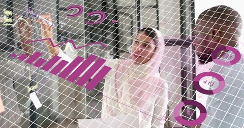 Businesswoman Using Glass Board with Magenta Charts in Office