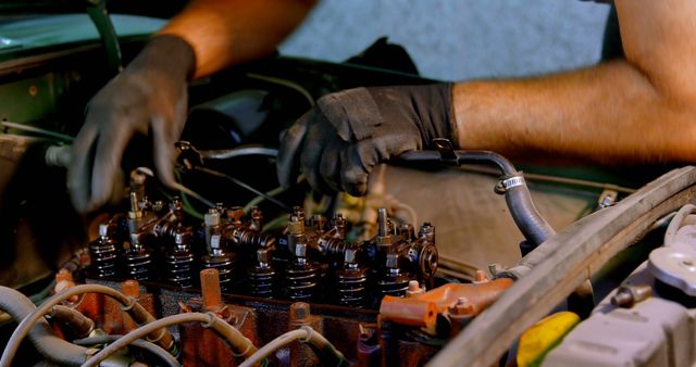 Mechanic Working on Engine Block of Car in Garage - Download Free Stock Images Pikwizard.com