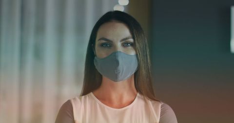 Woman wearing face mask during covid-19 pandemic indoors