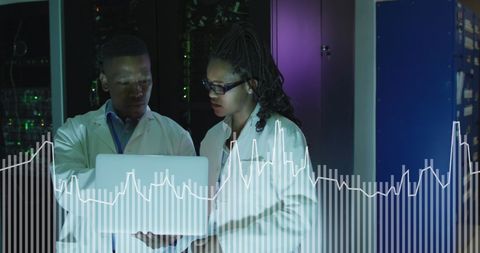 African American Professionals Analyzing Data in Server Room - Download Free Stock Images Pikwizard.com