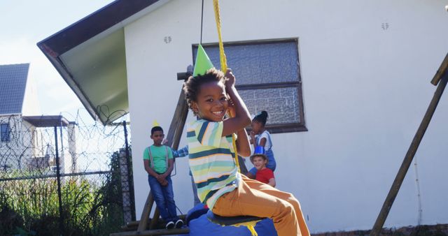 Happy Children Playing Outdoors on Swing - Download Free Stock Images Pikwizard.com