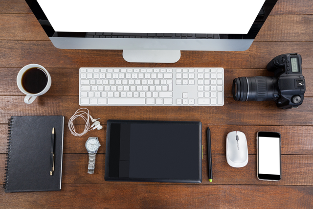 Organized Office Desk with Wireless Devices on Wooden Surface - Download Free Stock Videos Pikwizard.com