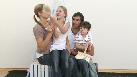 Happy Family Painting Together at Home