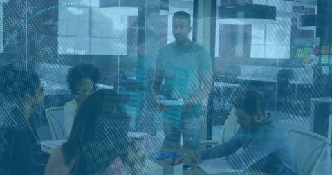 Business Team Discussing Ideas in High-Tech Office