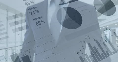 Financial Analyst Inspecting Business Graphs in Modern Office