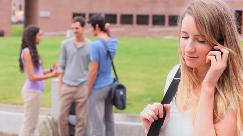 Student Making Phone Call on University Campus