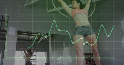 Athlete Pulling on Gym Rings While Training Overhead Strength with Green Data Grid Overlay