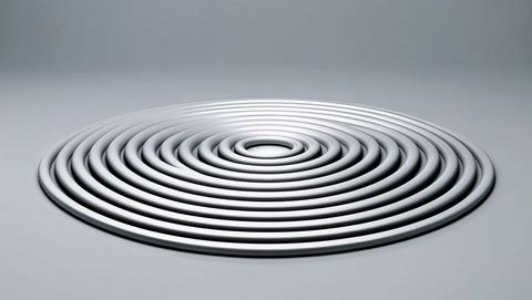 Metallic concentric sculpture with gradient backdrop