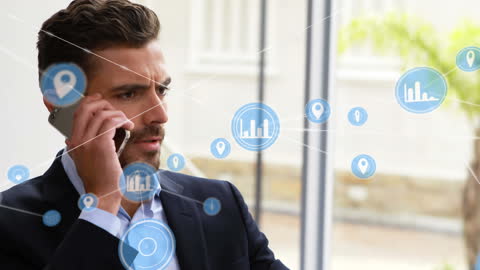 Businessman on Call Surrounded by Digital Analytics