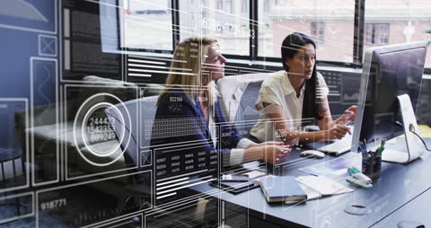 Tech-Savvy Coworkers Analyzing Data with Hybrid Digital Interface