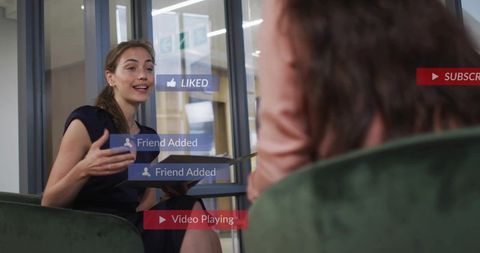Businesswoman leading digital meeting with AR overlays in modern glass coworking workspace