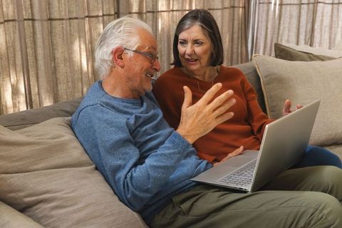 Senior Couple Relaxing at Home with Laptop, Cozy Domestic Lifestyle