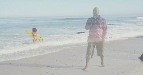 Relaxing elderly man drinking on tranquil beach