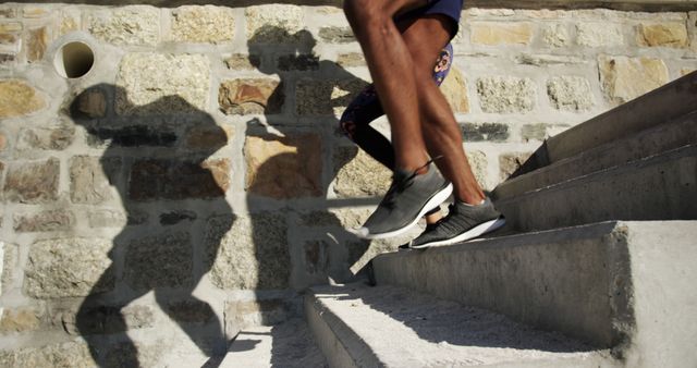 Close-Up of Athlete Running Up Stone Staircase Outdoors - Download Free Stock Images Pikwizard.com