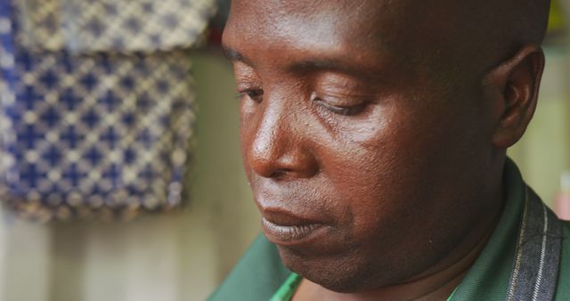 Close-Up of Pensive African Man Reflecting at Home - Download Free Stock Images Pikwizard.com