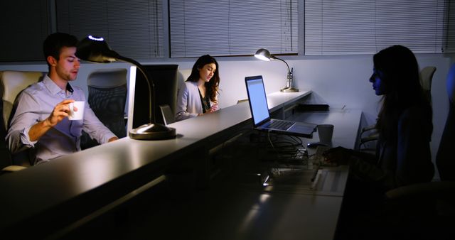 Business People Working Late at Office with Computers and Laptops - Download Free Stock Images Pikwizard.com