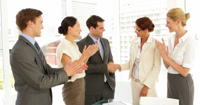 Business People Shaking Hands and Applauding in Office Meeting - Download Free Stock Images Pikwizard.com