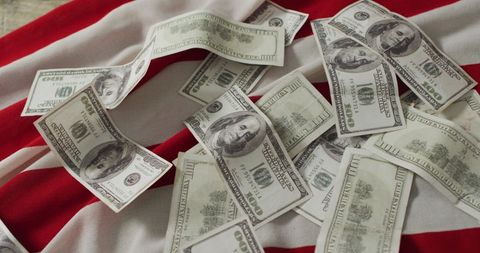 Scattered US Dollar Bills on American Flag Background - Download Free Stock Images Pikwizard.com