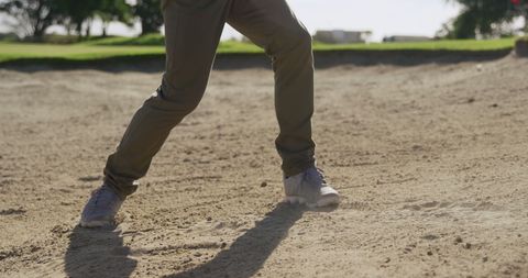 Golf Player Practicing in Bunker on Sunny Course - Download Free Stock Images Pikwizard.com