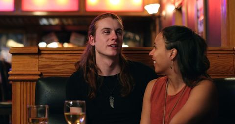 Friendly Conversation in Cozy Bar Setting