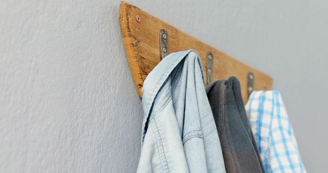 Wooden Wall Hook with Varied Shirts Hanging - Download Free Stock Images Pikwizard.com