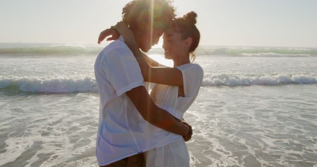 Romantic Couple Embracing by Ocean at Sunset - Download Free Stock Images Pikwizard.com