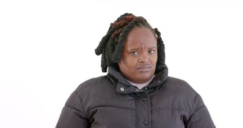 African american woman displaying confusion in winter coat