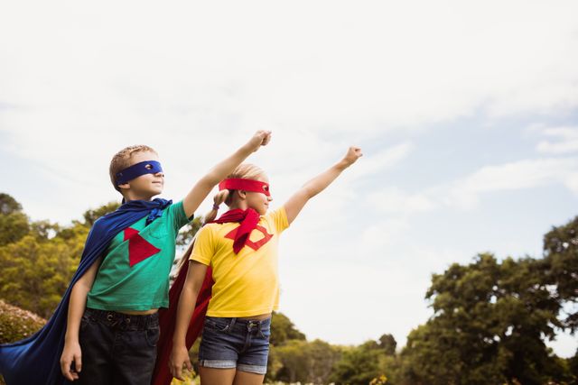 Children Pretending to Fly in Superhero Costumes in Park - Download Free Stock Photos Pikwizard.com