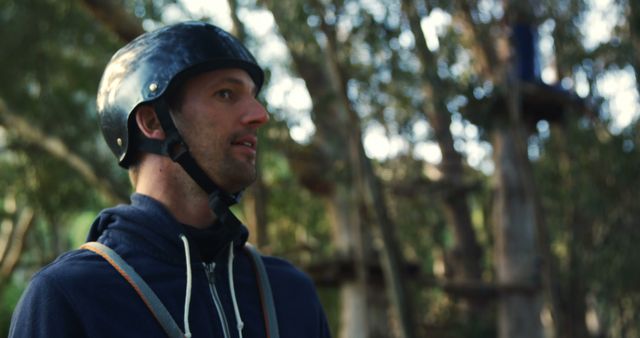 Man Wearing Helmet Enjoying Outdoor Adventure in Forest - Download Free Stock Images Pikwizard.com