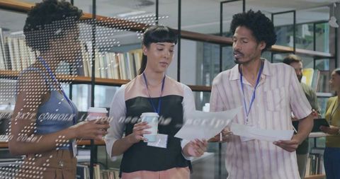 Creative Professionals Collaborating in Office Library Setting