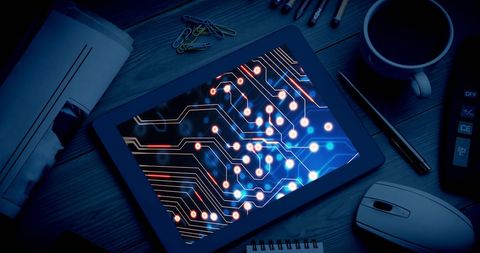 Tablet Displaying Data Processing Graphics in Office Setting