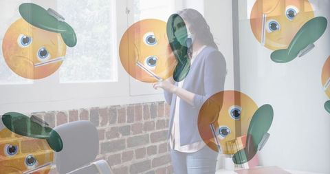 Sick emoji surrounded businesswoman on smartphone during pandemic