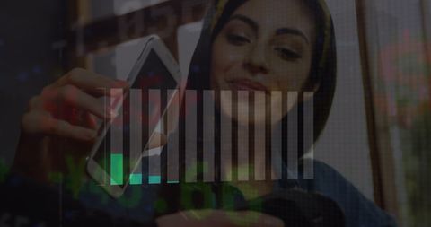 Woman Performing Contactless Payment with Smartphone and Financial Graphics