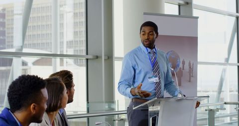 Business Professional Delivering Inspirational Seminar Presentation