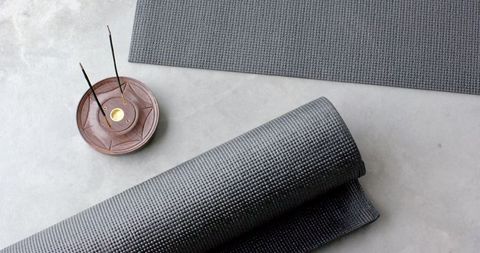 Zen home meditation space with yoga mats and incense holder