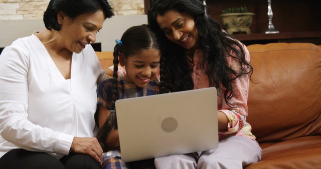 Three Generation Family Bonding With Laptop on Sofa - Download Free Stock Images Pikwizard.com