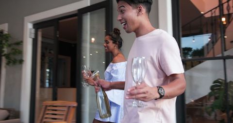 Elegant couples setting up dinner celebration outdoors