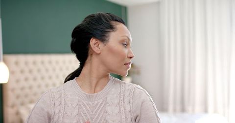 Tranquil moment in modern bedroom with green accent wall
