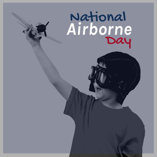 Monochrome image of a boy enthusiastically holding a toy airplane, wearing a vintage-style helmet. The background includes text for National Airborne Day. Ideal for use in promotional materials for aviation events, social media posts celebrating National Airborne Day, and educational content about the history of aviation. It depicts the joy and imagination children associate with flying.