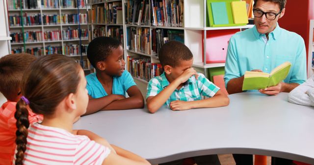 Teacher Reading Book to Diverse Group of Children in Library - Download Free Stock Images Pikwizard.com